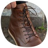 The Boot in Chestnut by Amberjack - close up of leather and laces