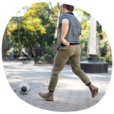 Chelsea Slate on model running kicking soccer ball